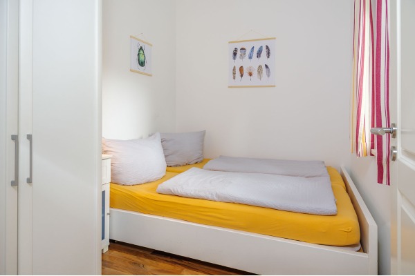 Schlafzimmer Ferienhaus Fiete mit Feder Bild